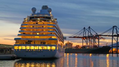 crystal serenity cruise ship in harbor at sunset