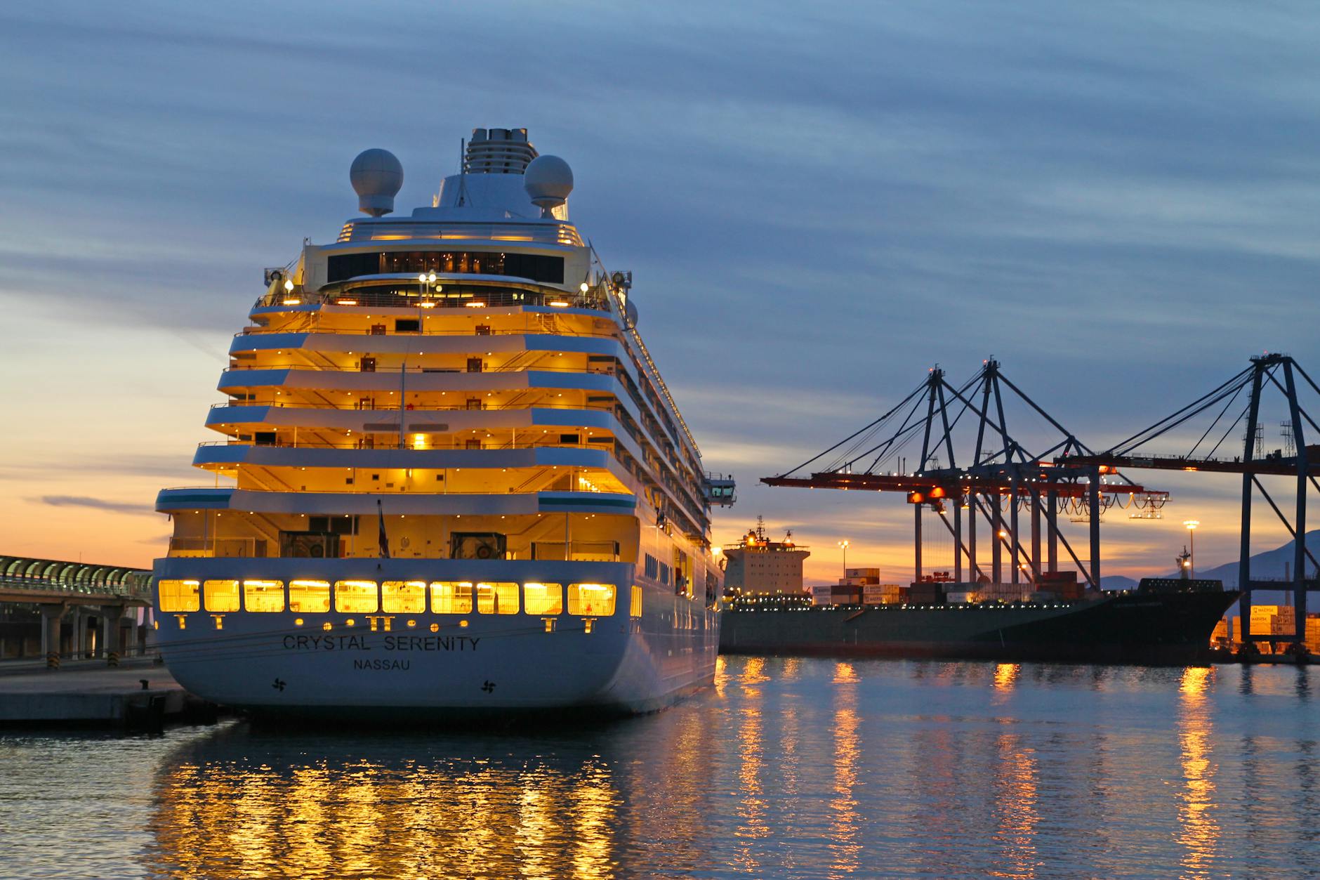 crystal serenity cruise ship in harbor at sunset