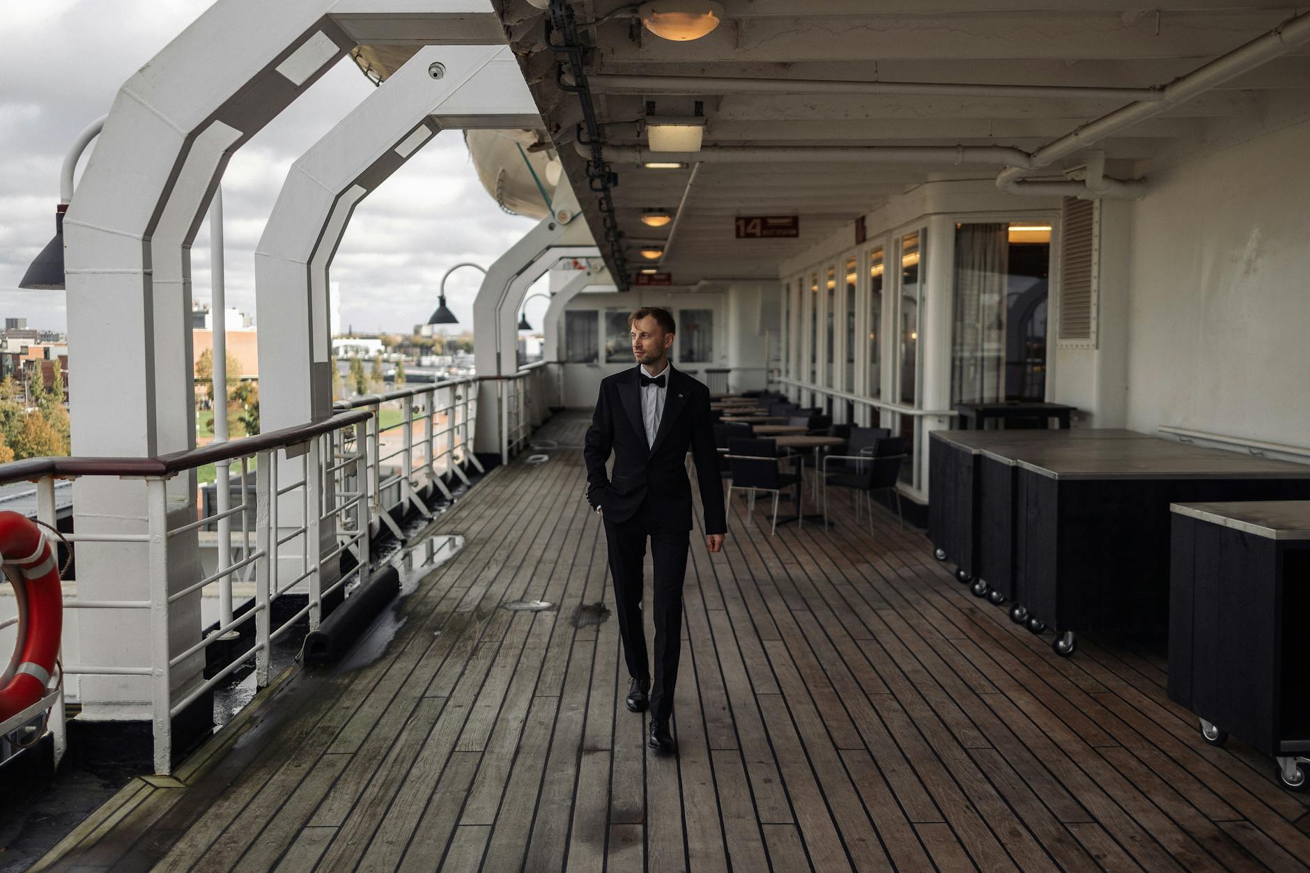 elegant man in tuxedo on ship