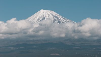 city of shizuoka with mount fuji shrouded in clouds in the background