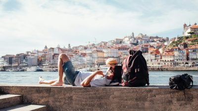 man lying in port in porto