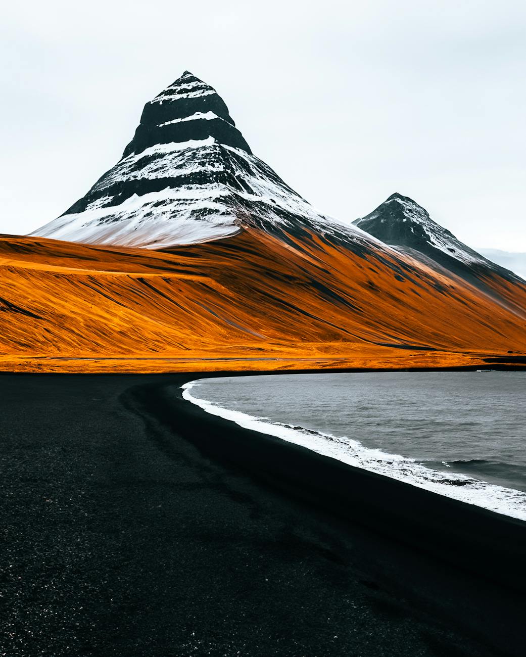 black beach and mountains in iceland