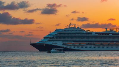 photo of a cruise ship at dusk