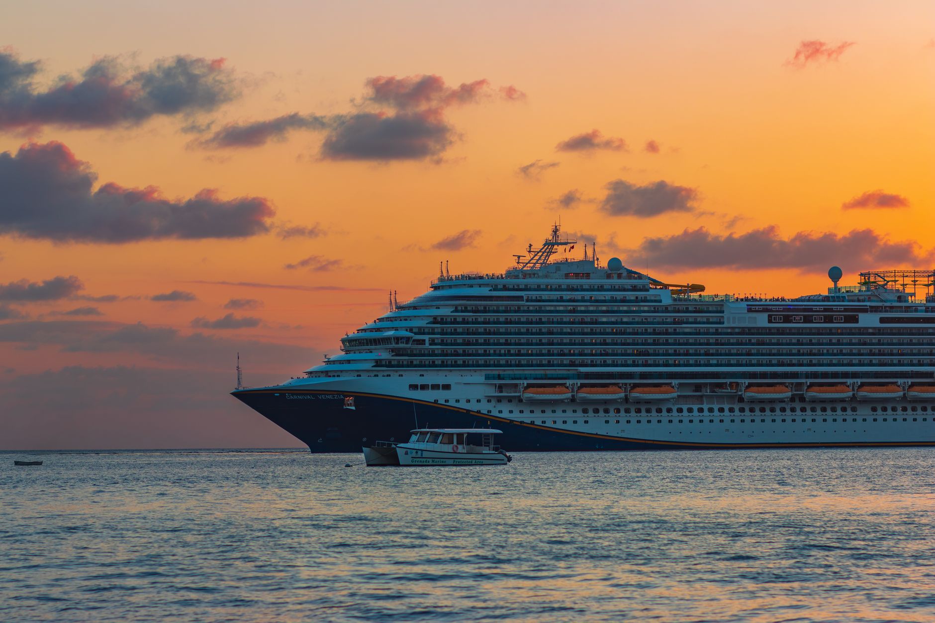 photo of a cruise ship at dusk