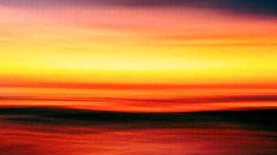 an abstract photograph of a sunset over the ocean