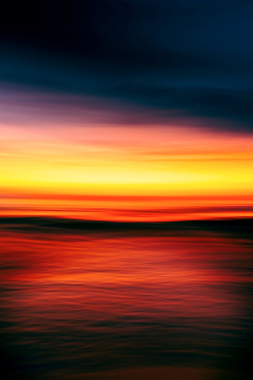 an abstract photograph of a sunset over the ocean