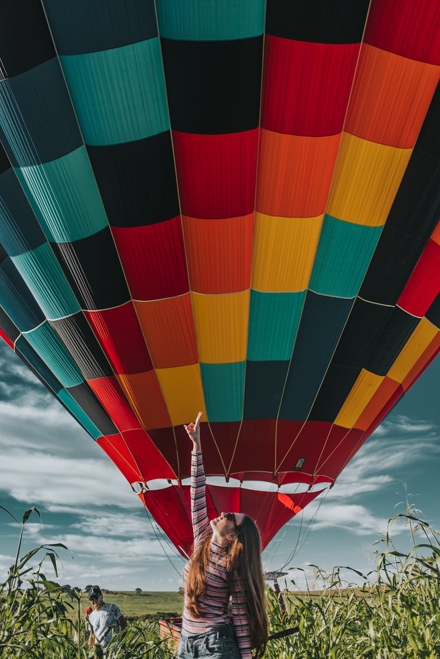 woman standing near hot air balloon