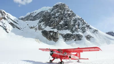 red monoplane in alps