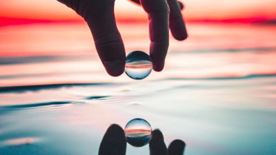 person holding marble toy