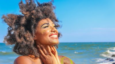 close up photo of woman with afro hair