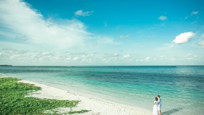 man and woman watching the horizon