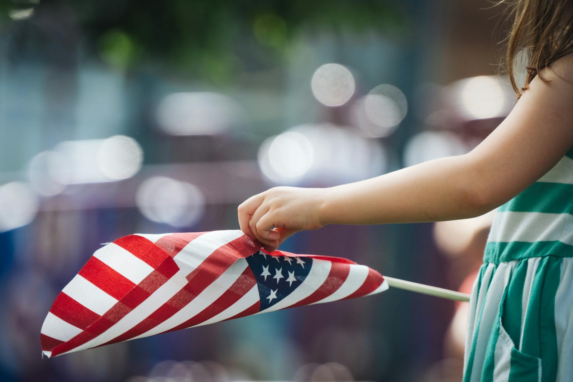 girl holding a flag of usa