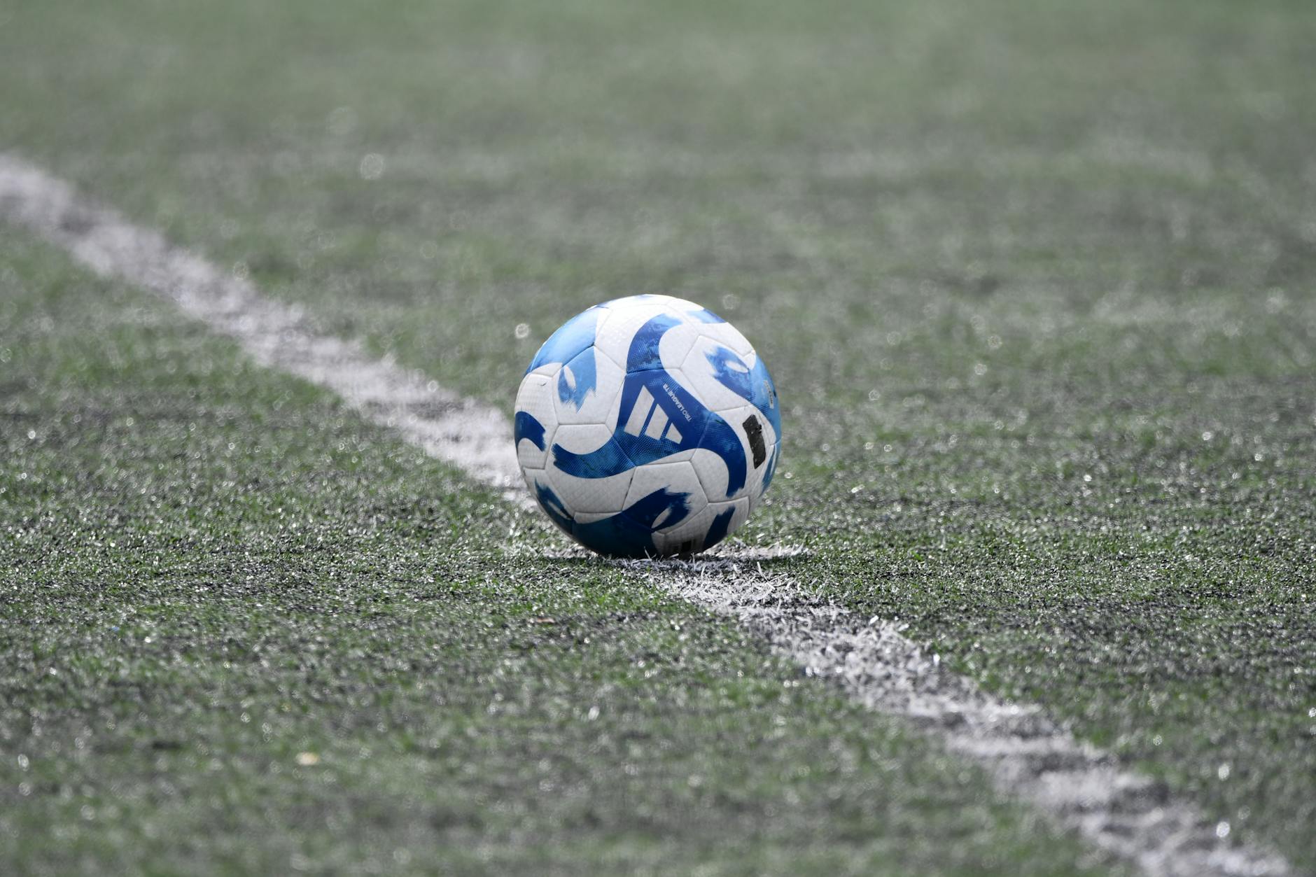 adidas tiro league ball on the soccer field