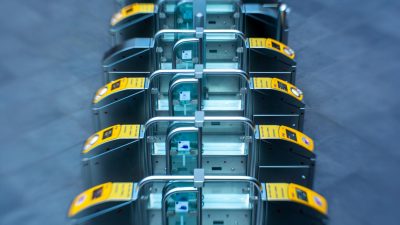 a row of yellow and black ticket machines