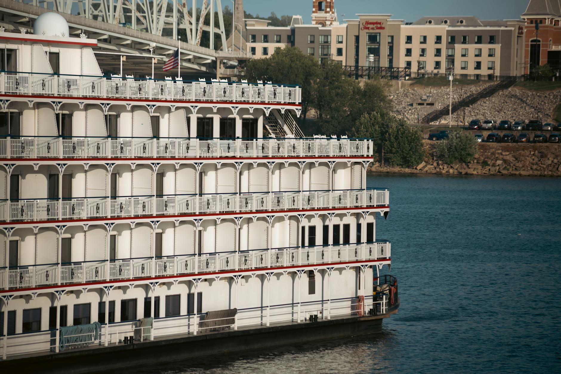 a large white boat is docked in the water