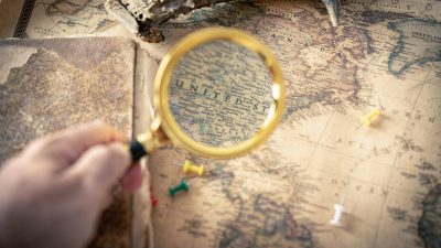 person holding magnifying glass