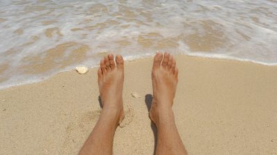 relaxing at the beach with sandy toes
