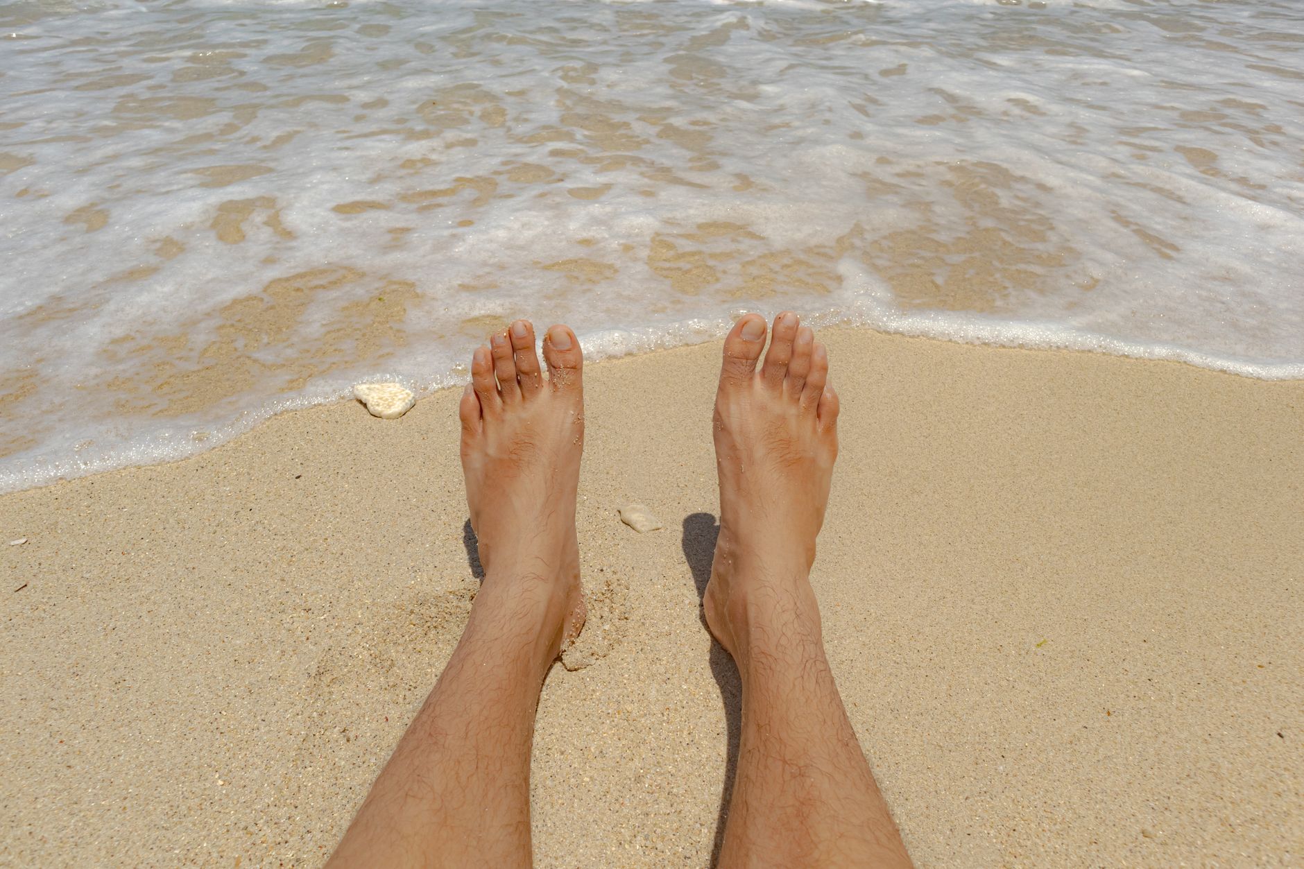 relaxing at the beach with sandy toes