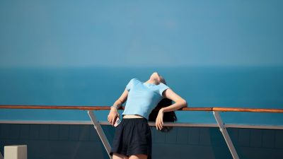 young woman relaxing on cruise ship deck