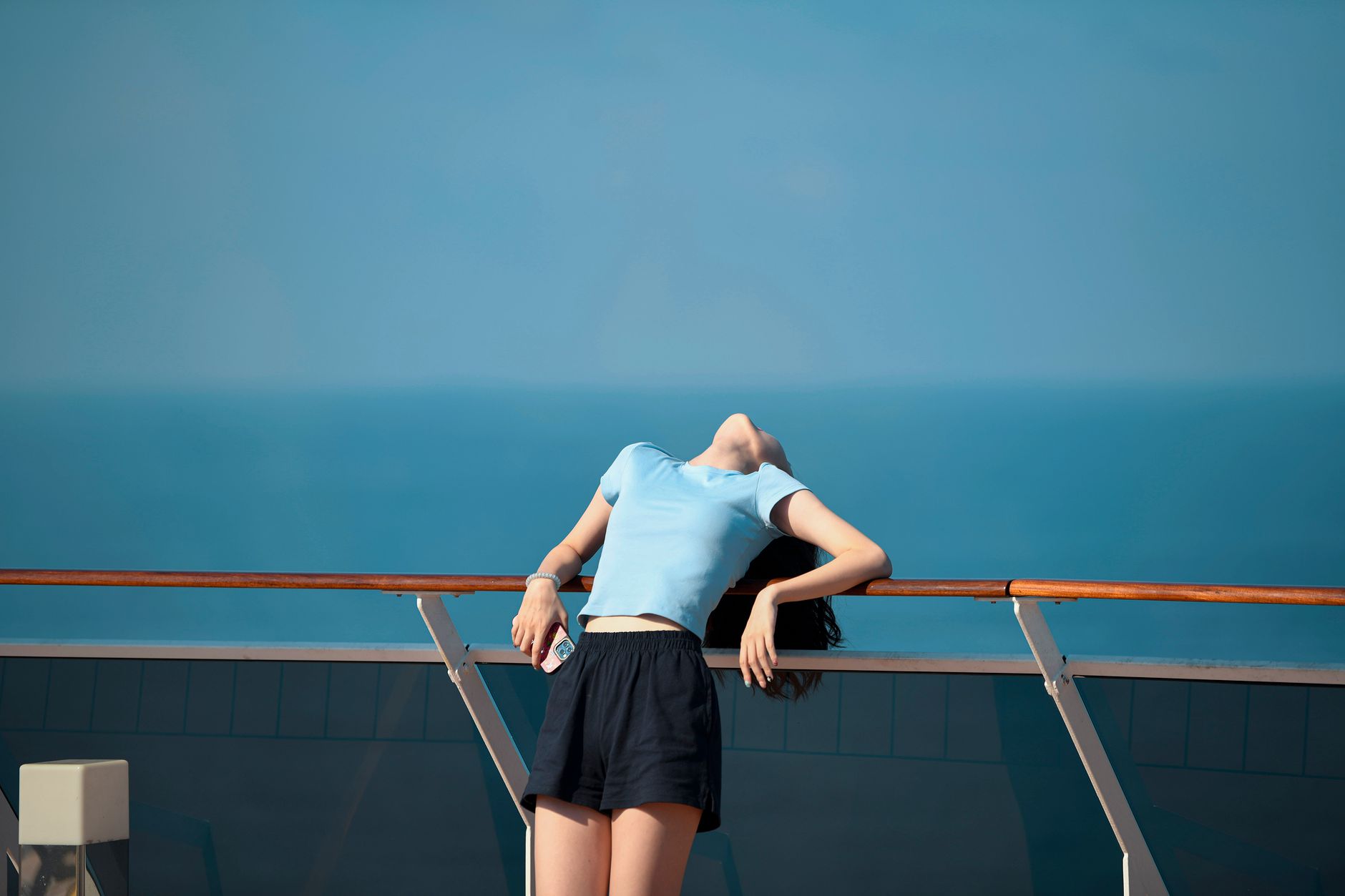 young woman relaxing on cruise ship deck