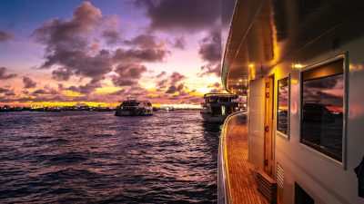 luxury yacht at sunset in the maldives
