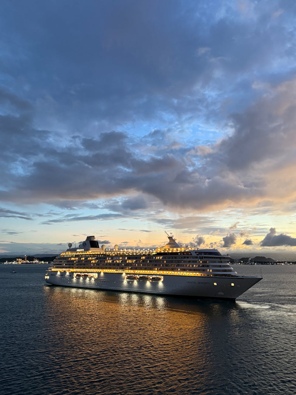 luxury cruise ship at sunset on open sea