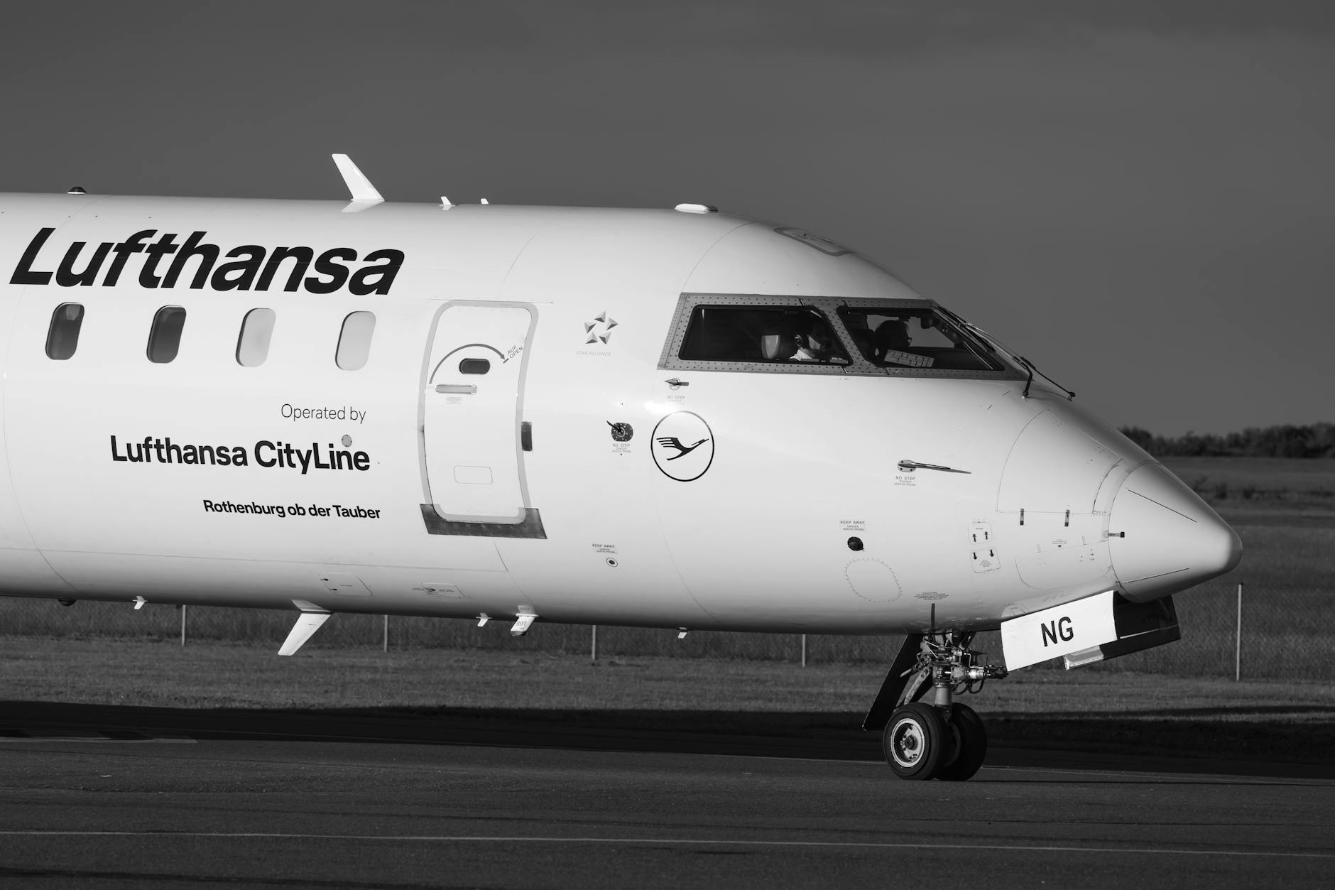 lufthansa cityline aircraft taxiing on runway