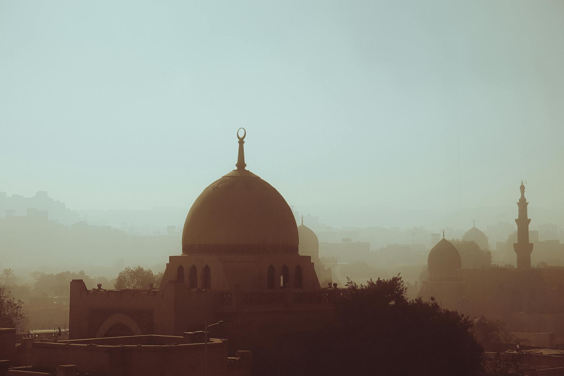 misty cairo skyline with historic minarets