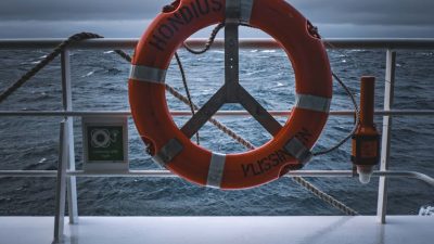 life saver ring on ship deck overlooking ocean