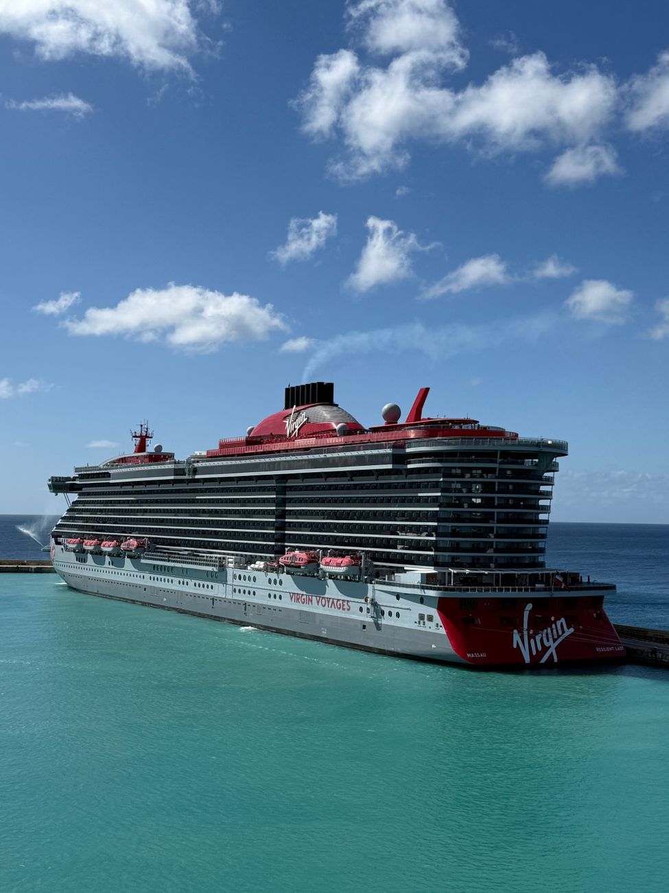 luxurious cruise ship docked at scenic port