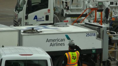 airline ground crew at busy airport terminal