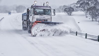 heavy duty snow plow clearing winter roadway