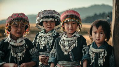 children in traditional tribal attire outdoors