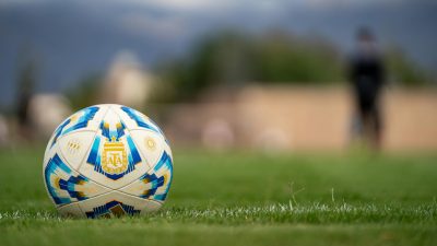 close up of soccer ball on green field