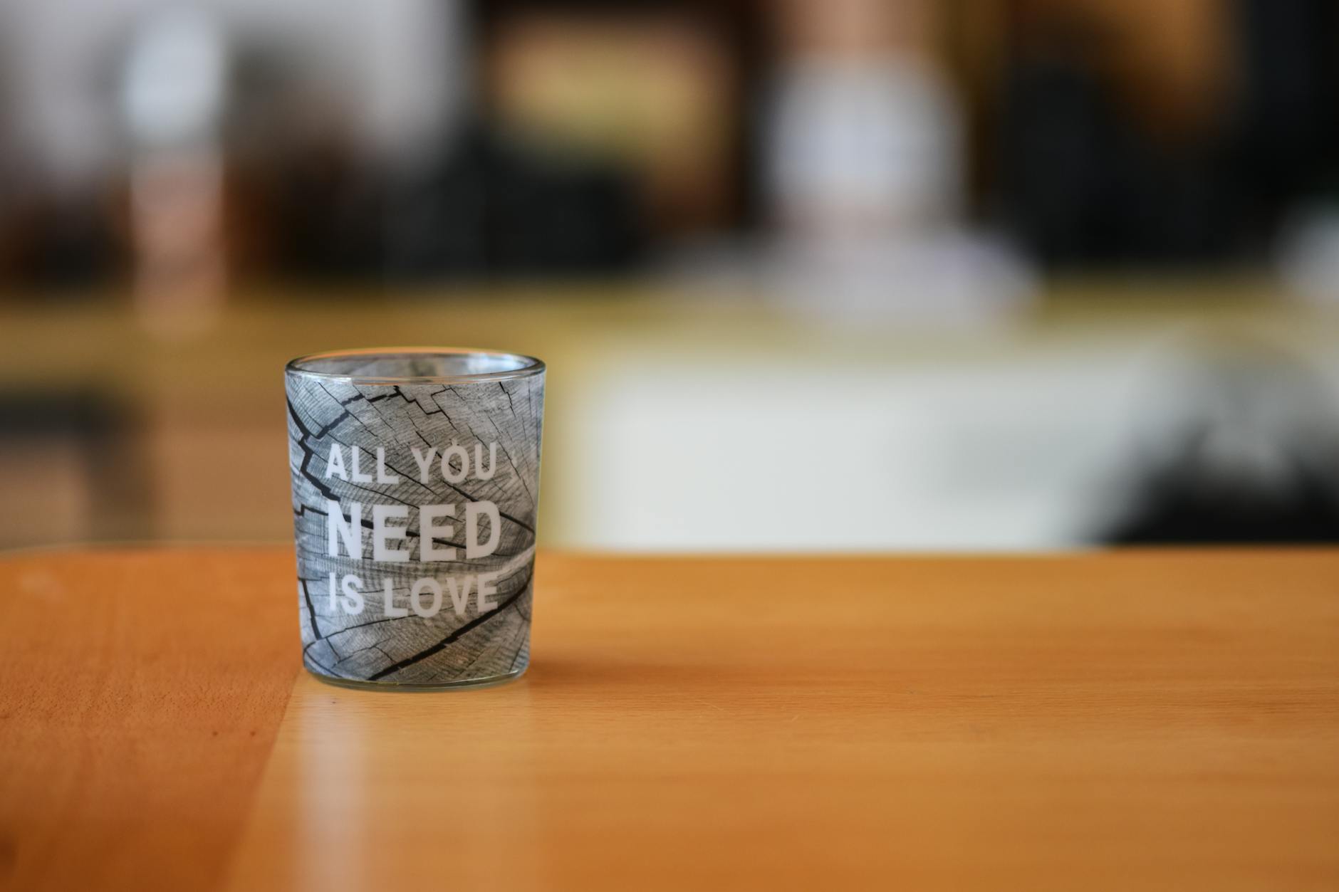 glass cup with inspirational love quote