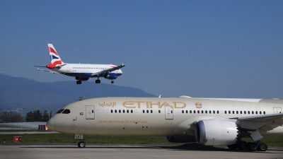 airplanes in geneva airport during daytime