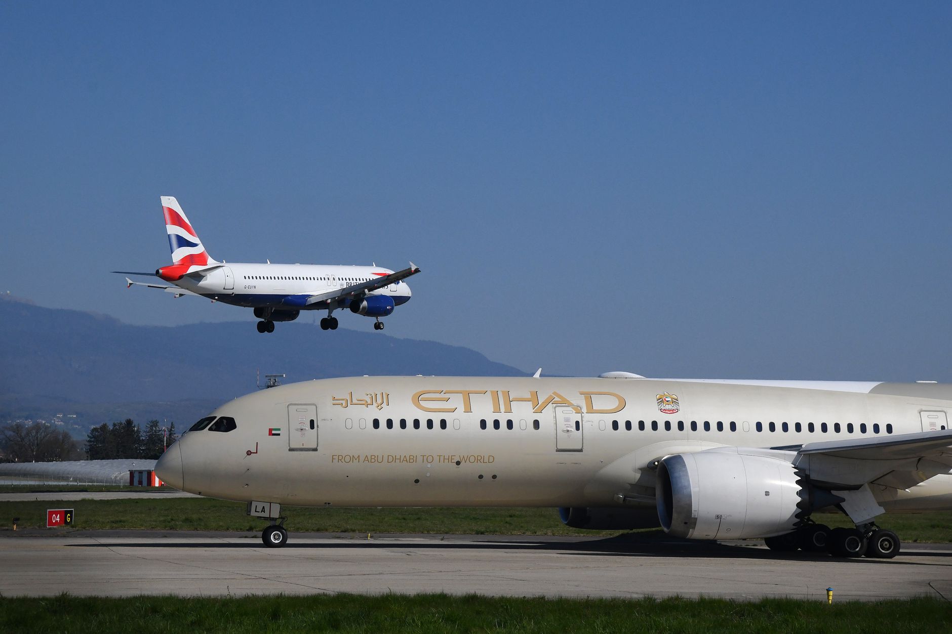 airplanes in geneva airport during daytime