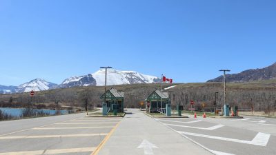 remote canadian border crossing with mountains