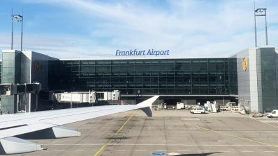 frankfurt airport terminal with airplane wing view