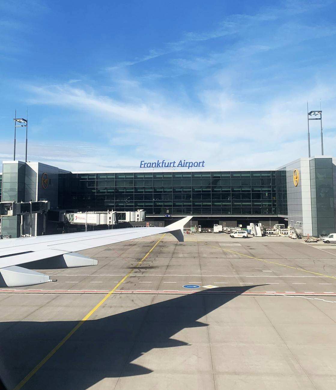 frankfurt airport terminal with airplane wing view