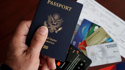 close up of us passport with travel essentials
