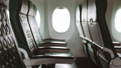empty aircraft cabin with window seats