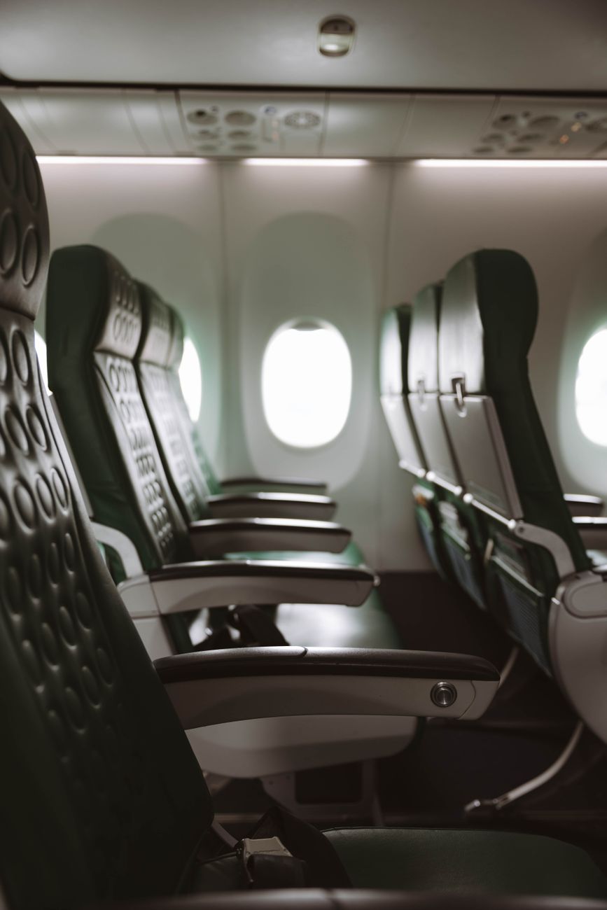 empty aircraft cabin with window seats
