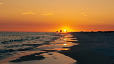 serene sunset on destin beach with reflections