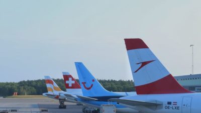 airplanes parked at oslo airport during daylight
