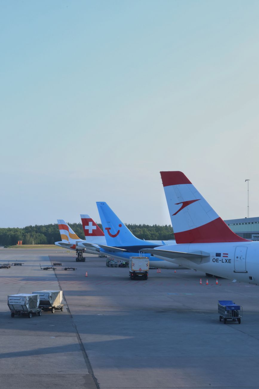 airplanes parked at oslo airport during daylight