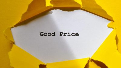 torn yellow paper revealing good price message