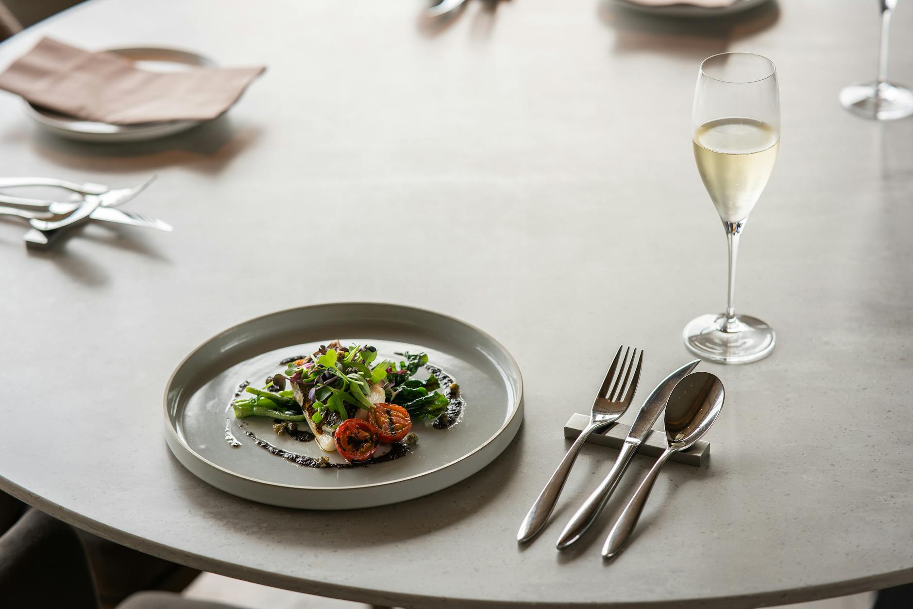 elegant fine dining with gourmet plate and champagne
