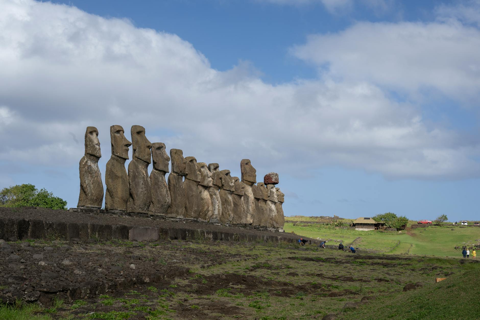 moai statues of easter island under blue skies
