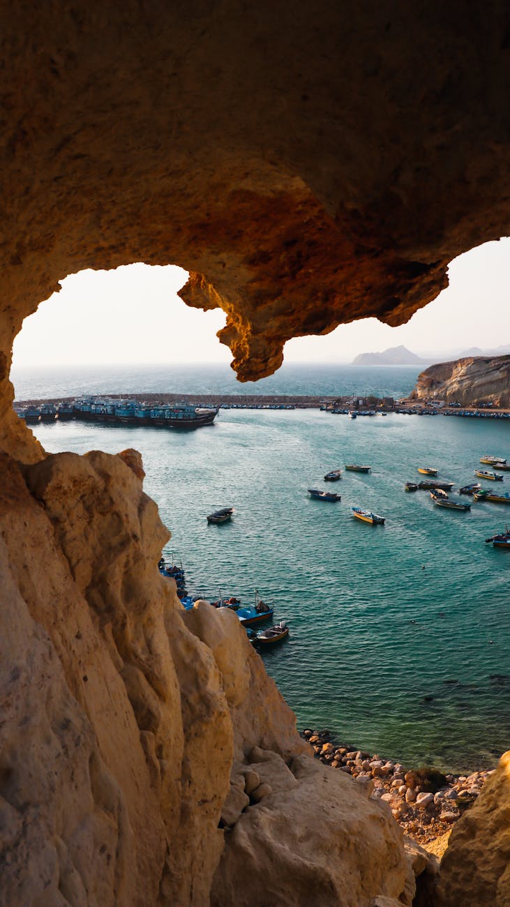 scenic cove with vibrant boats at sunset